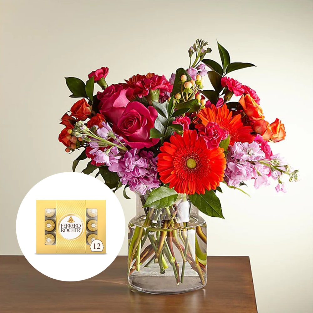 Bouquet Fiesta, Deluxe + Chocolate Ferrero Rocher x12 unidades, Su Hermosa Mezcla De Flores Te Garantiza Un Ramo Único Cada Vez. Flores: Margaritas, Claveles, Nuestro Bouquet Fiesta Hará De Tu Ocasión Especial Un Momento Memorable. Flores De Cumpleaños, Margaritas, Claveles, Fresh Flowers Orlando, Florida, Delivery.