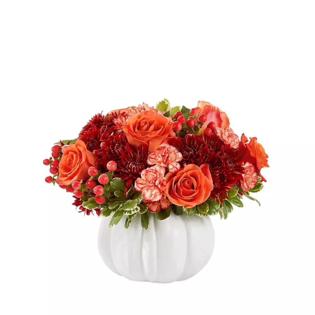 Flowers in a decorative white pumpkin