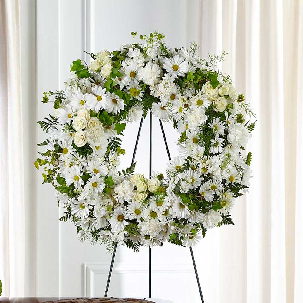 Sympathy Buenos Deseos y Reposo (Faithful Wishes Wreath) Nuestra corona de deseos fieles combina flores blancas clásicas en una corona atemporal para mostrar su amor, paz y respeto. Fresh Flowers Orlando