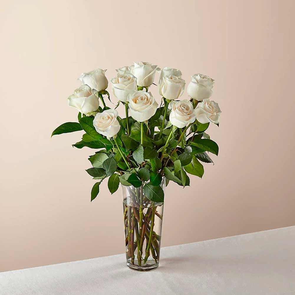 Long Stem White Rose Bouquet. With a gorgeous selection of crisp white roses among fresh greenery, this bouquet is perfect for birthdays, anniversaries, or as a way to say, "I&
