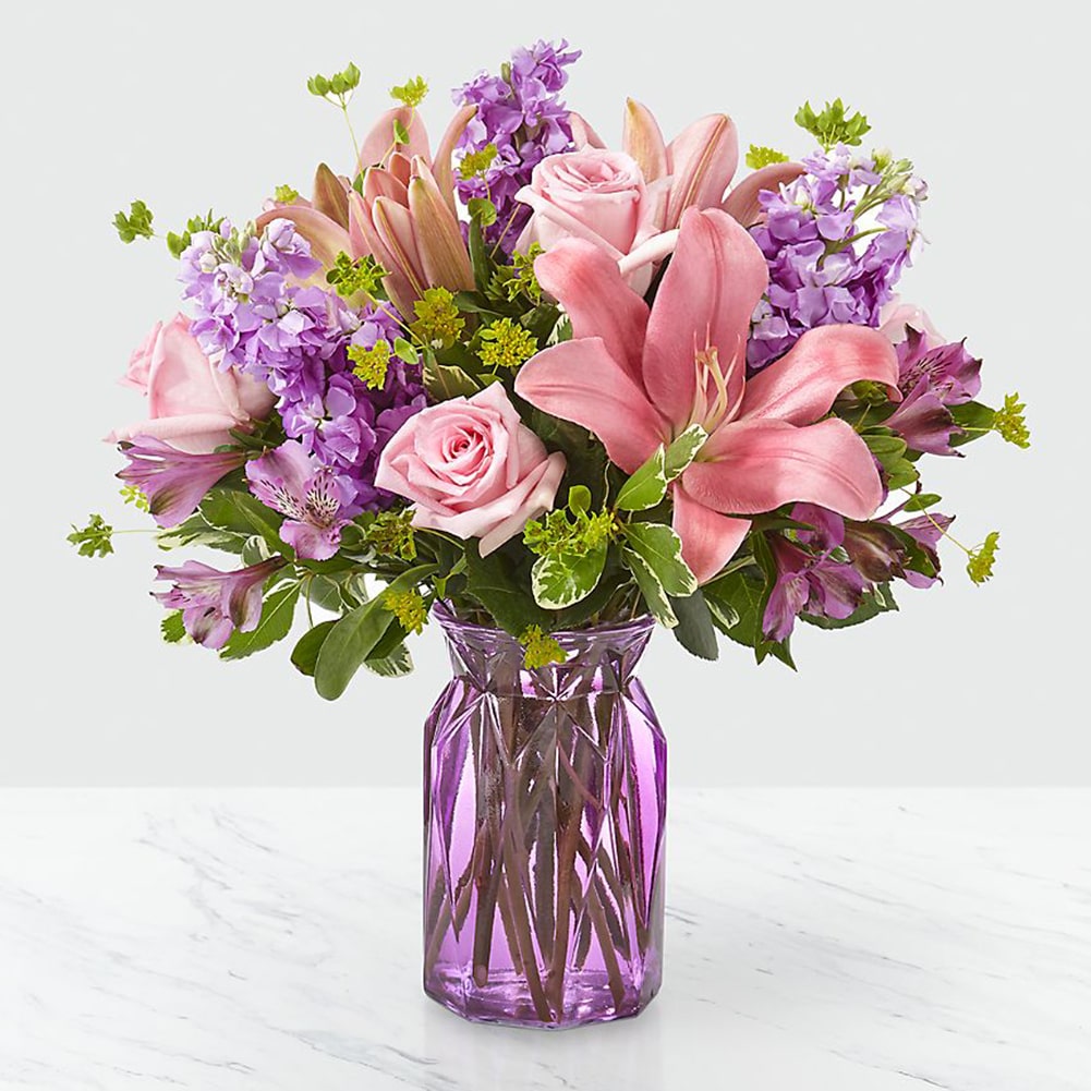 Surprise mom with this beautiful gift of flowers! Our arrangement includes elegant lilies and roses in a glass vase, flower delivery and gifts for mom, Fresh Flowers Orlando Florist, florist.
