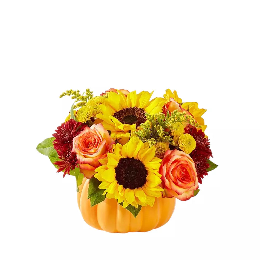 Girasoles y claveles en florero naranja