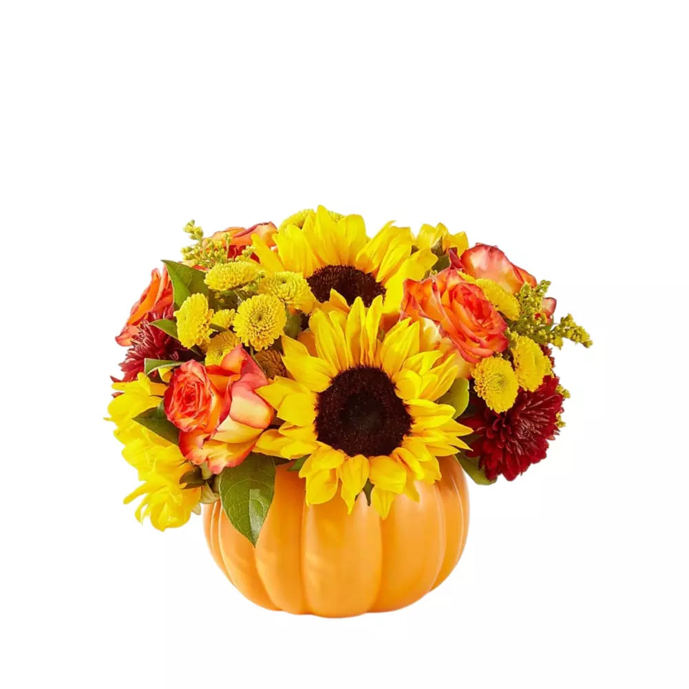 Sunflowers and carnations in an orange vase