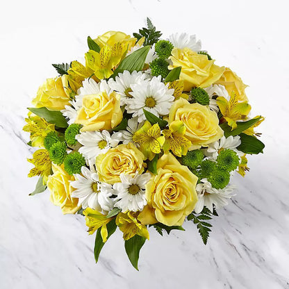 Express your love with our Yellow Flowers For Mom. 🏵️ Featuring a combination of yellow and white flowers, these are the perfect gift to tell Mom how much you love her.