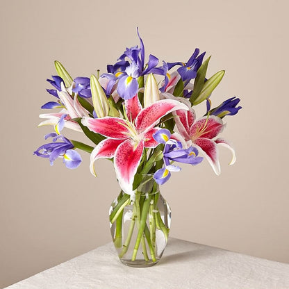Belle Bouquet, Arranged with elegant florals and fragrance, this show-stopping collection of lilies and irises shares the perfect expression for any reason or occasion. Fresh Flowers Orlando.