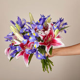 Belle Bouquet, Arranged with elegant florals and fragrance, this show-stopping collection of lilies and irises shares the perfect expression for any reason or occasion. Fresh Flowers Orlando.