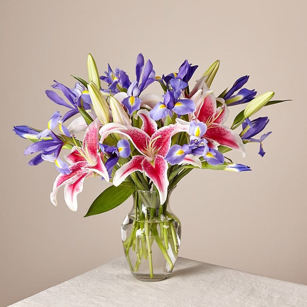 Belle Bouquet, Arranged with elegant florals and fragrance, this show-stopping collection of lilies and irises shares the perfect expression for any reason or occasion. Fresh Flowers Orlando.