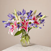 Belle Bouquet, Arranged with elegant florals and fragrance, this show-stopping collection of lilies and irises shares the perfect expression for any reason or occasion. Fresh Flowers Orlando.
