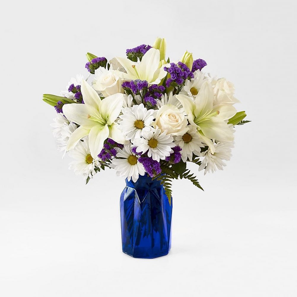Blue Bouquet, Perfect for complementing any message you want to send, our Blue Bouquet features a deep blue vase and a gorgeous array of white and purple blooms. Fresh Flowers Orlando.