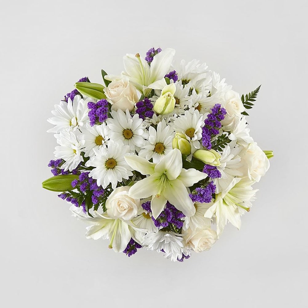 Blue Bouquet, Perfect for complementing any message you want to send, our Blue Bouquet features a deep blue vase and a gorgeous array of white and purple blooms. Fresh Flowers Orlando.