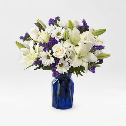 Blue Bouquet, Perfect for complementing any message you want to send, our Blue Bouquet features a deep blue vase and a gorgeous array of white and purple blooms. Fresh Flowers Orlando.