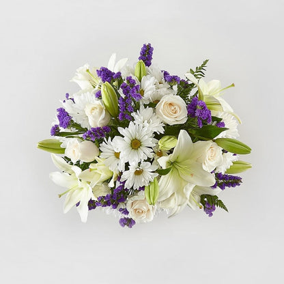 Blue Bouquet, Perfect for complementing any message you want to send, our Blue Bouquet features a deep blue vase and a gorgeous array of white and purple blooms. Fresh Flowers Orlando.