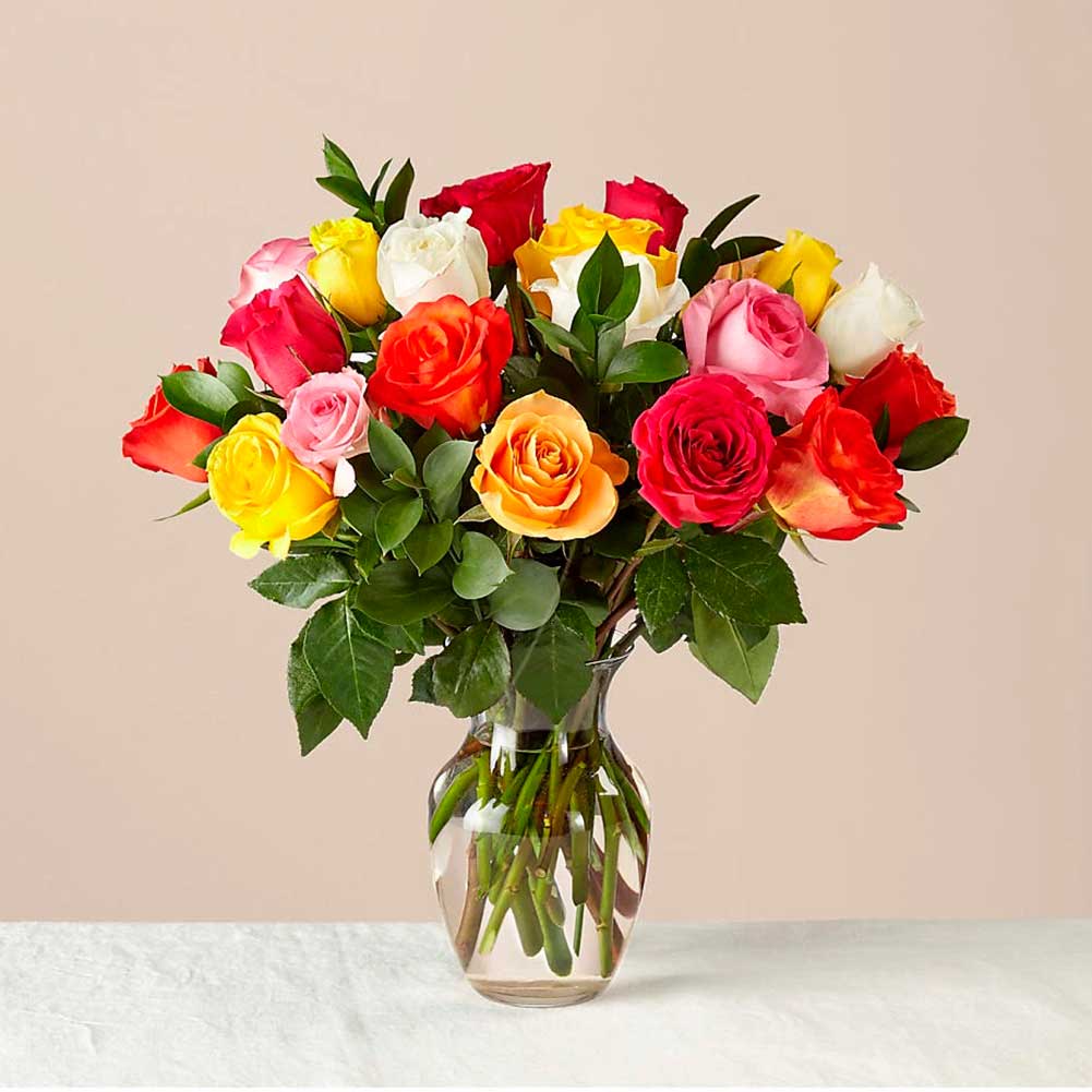 Mixed Roses with Vase. Colorful and blooming, this vibrant bouquet of a dozen roses is an instant mood booster. Fresh Flowers Orlando.
