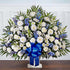 Sympathy Canasta De Piso, Size Extra Large, Fresh Flowers Orlando. Floor basket arrangement of blue delphinium; white roses, snapdragons, cremones, carnations, daisy poms and monte casino; accented with soft, lush greenery. Arreglo de canasta de piso con blue delphinium; rosas blancas, dragones, cremonas, claveles, margaritas y monte casino; decorado con vegetación en tonos verdes suaves.